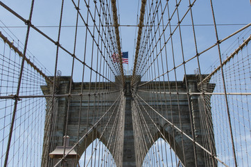 Obraz premium Brooklyn Bridge with American flag
