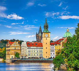 Fall landscape view to Charles bridge on Vltava river in Prague