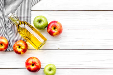 Homemade cider from ripe apples. White wooden background top view copy space