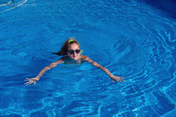 teen girl relaxing near swimming pool