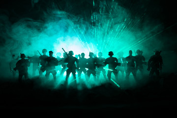 Anti-riot police give signal to be ready. Government power concept. Police in action. Smoke on a...