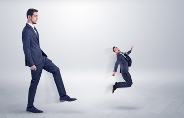 Small man fired by boss with white wallpaper