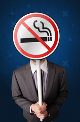Businessman holding no smoking sign