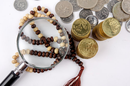 Rosary and coins. Islamic Banking/Finance concept.