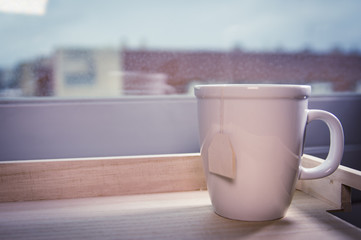 White blank mug on a rainy day. Quiet, relaxing and serene scene.
