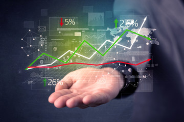 Businessman holding stock data