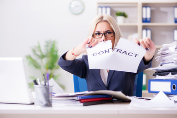 Businesswoman with message in office at desk