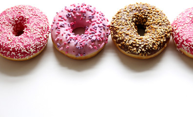 Glazed donuts on white background. Top view