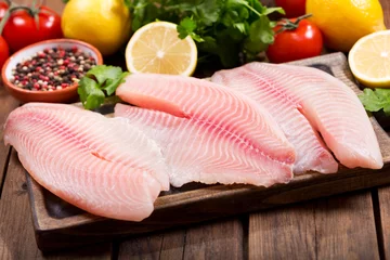 Photo sur Plexiglas Poisson fresh fish fillet with ingredients for cooking