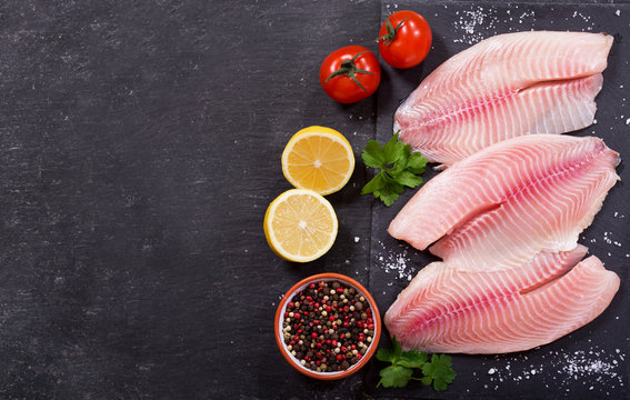 fresh fish fillet with ingredients for cooking
