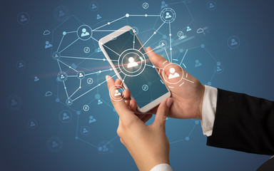 Hand using smartphone to connect people concept