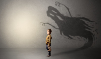 Scary ghost shadow behind kid