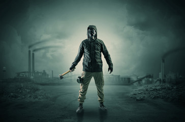 Naklejka premium Gas masked men in demolished environment