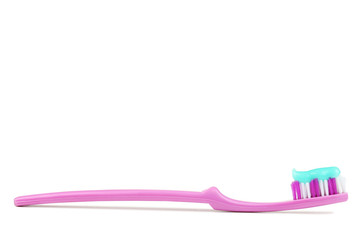 Pink toothbrush isolated on white background