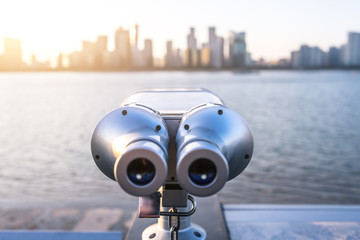 telescope with panoramic cityscape
