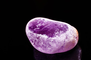 Macro mineral amethyst on a black background