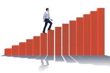 Businessman going up the bar chart in growth concept