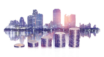 double exposure of business financial with coin stacking and city on white background. business and...