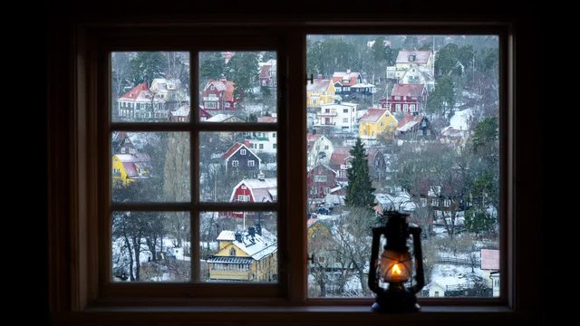 Residential villas in Stockholm, Sweden seen through a window on a snowy and wintry day