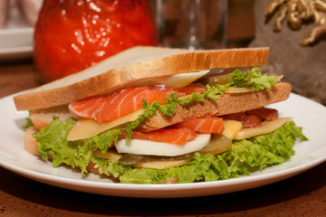 Sandwich with salmon. Sandwich with red fish.Sandwich isolated white background.