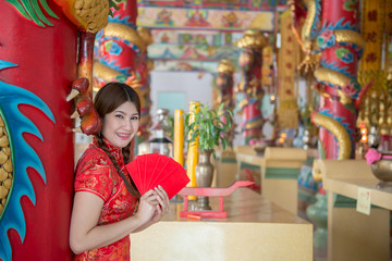 Portrait of beautiful asian woman in Cheongsam dress,Thailand people,Happy Chinese new year concept