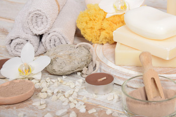 Fototapeta na wymiar gray natural soap with honey and body oil and a cosmetic face mask