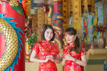 Portrait of beautiful asian woman in Cheongsam dress,Thailand people,Happy Chinese new year concept