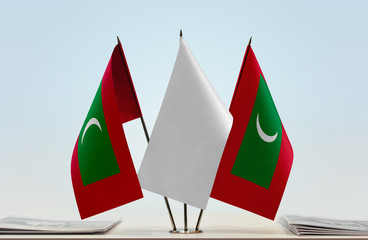 Two flags of Maldives with a white flag in the middle