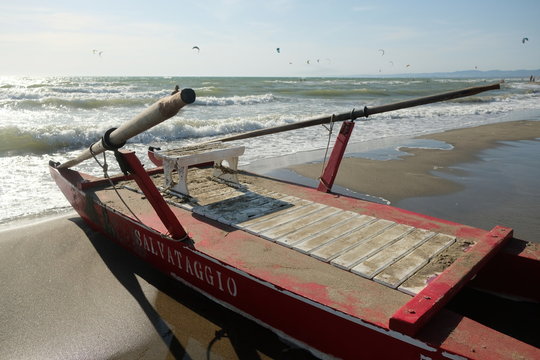 Italian paddle boat for the rescue (Italian: salvataggio) moored on the beach
