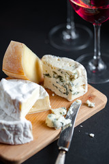 Cheese platter and two glasses of red wine