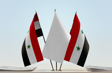 Two flags of Syria with a white flag in the middle