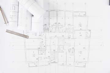 Architectural project, engineering tools on table.