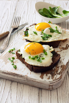 Rye bread toasts with fried eggs