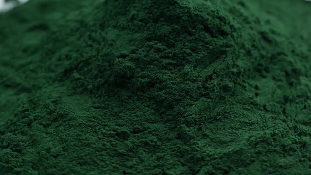 Spirulina Algae Powder, close up.Macro, selective focus
