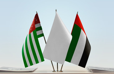 Flags of Abkhazia and UAE with a white flag in the middle