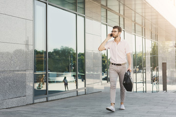 Confident businessman talking on phone