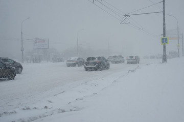 Heavy snowfall in Moscow. 04/02/2018. Transport on the road.