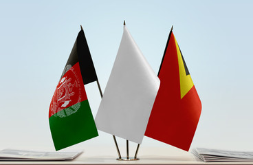 Flags of Afghanistan and East Timor with a white flag in the middle