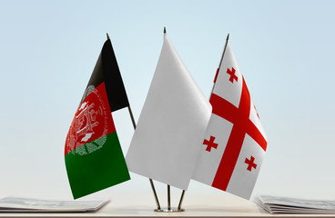 Flags of Afghanistan and Georgia with a white flag in the middle