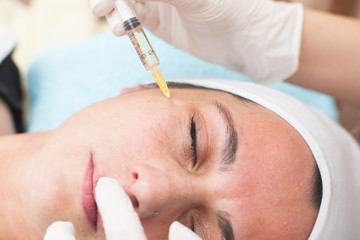Naklejka premium close up of a young woman having mesotherapy treatment