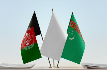 Flags of Afghanistan and Turkmenistan with a white flag in the middle
