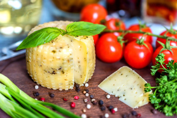 Rustic cheese with herbs, pepper and vegetables