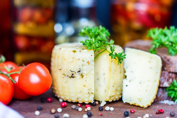 Rustic cheese with herbs, pepper and vegetables