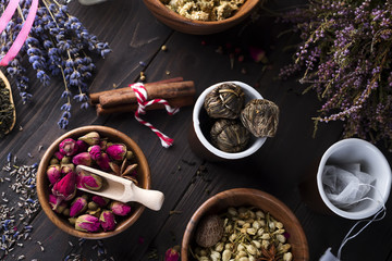 Collection of tea and natural additives in wooden