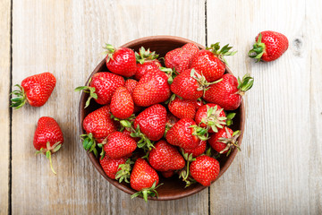 strawberry in a clay plate