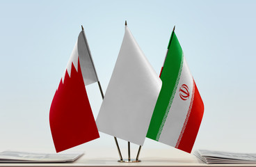 Flags of Bahrain and Iran with a white flag in the middle