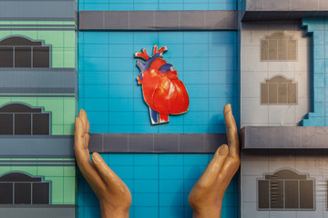 Protect your heart and lead a healthy life. This image depicts a hand protecting the heart.