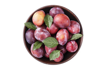 fresh plum in a wooden plate