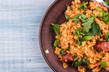 Classical Louisiana Jambalaya from chicken, rice and smoked sausages - copy space, a place for a recipe