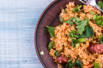 Classical Louisiana Jambalaya from chicken, rice and smoked sausages - copy space, a place for a recipe